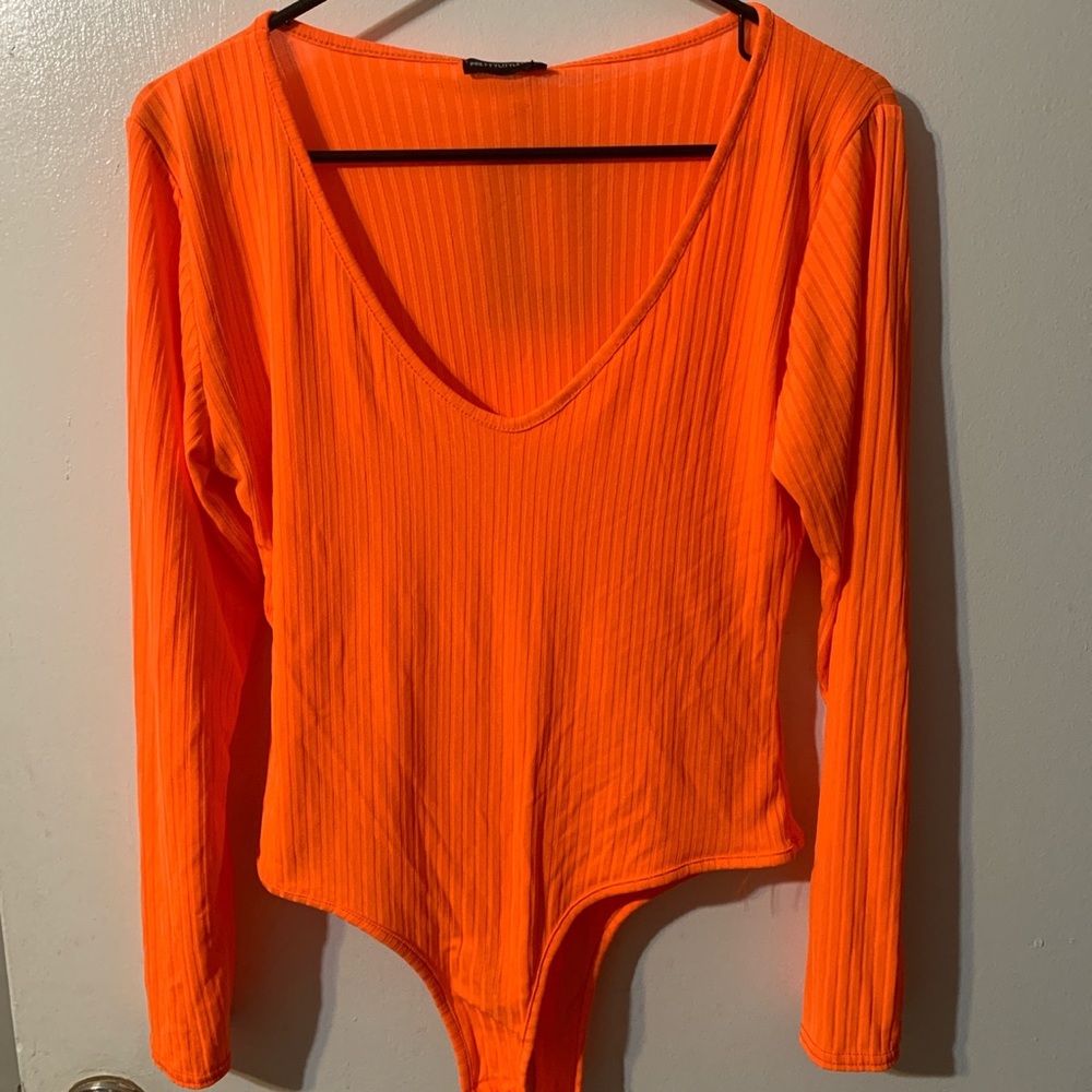 Orange long sleeve bodysuit